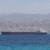 Oil tanker sailing through the Strait of Hormuz amid global oil market tensions