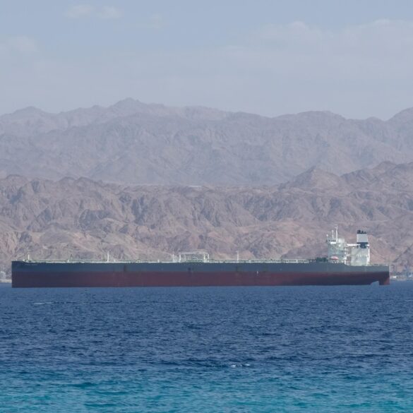 Oil tanker sailing through the Strait of Hormuz amid global oil market tensions